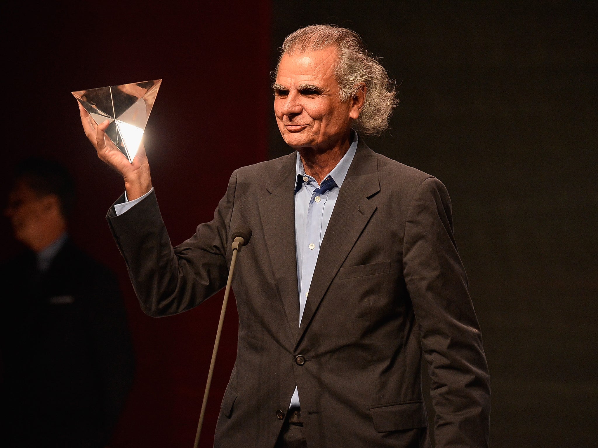 Demarchelier receiving the Photographer of the Year award in 2013