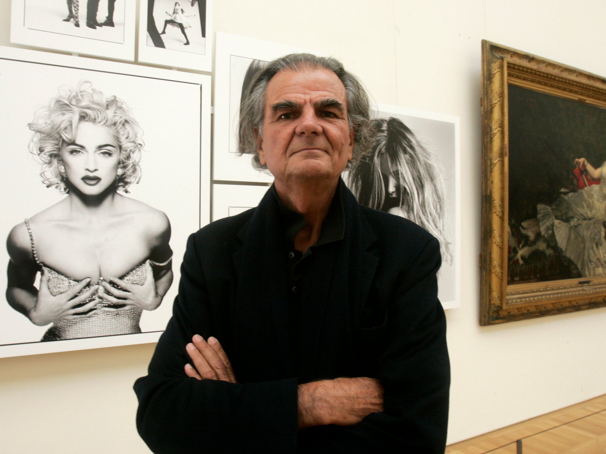 Demarchelier with one of his photographs of Madonna on display at the Petit Palais in Paris