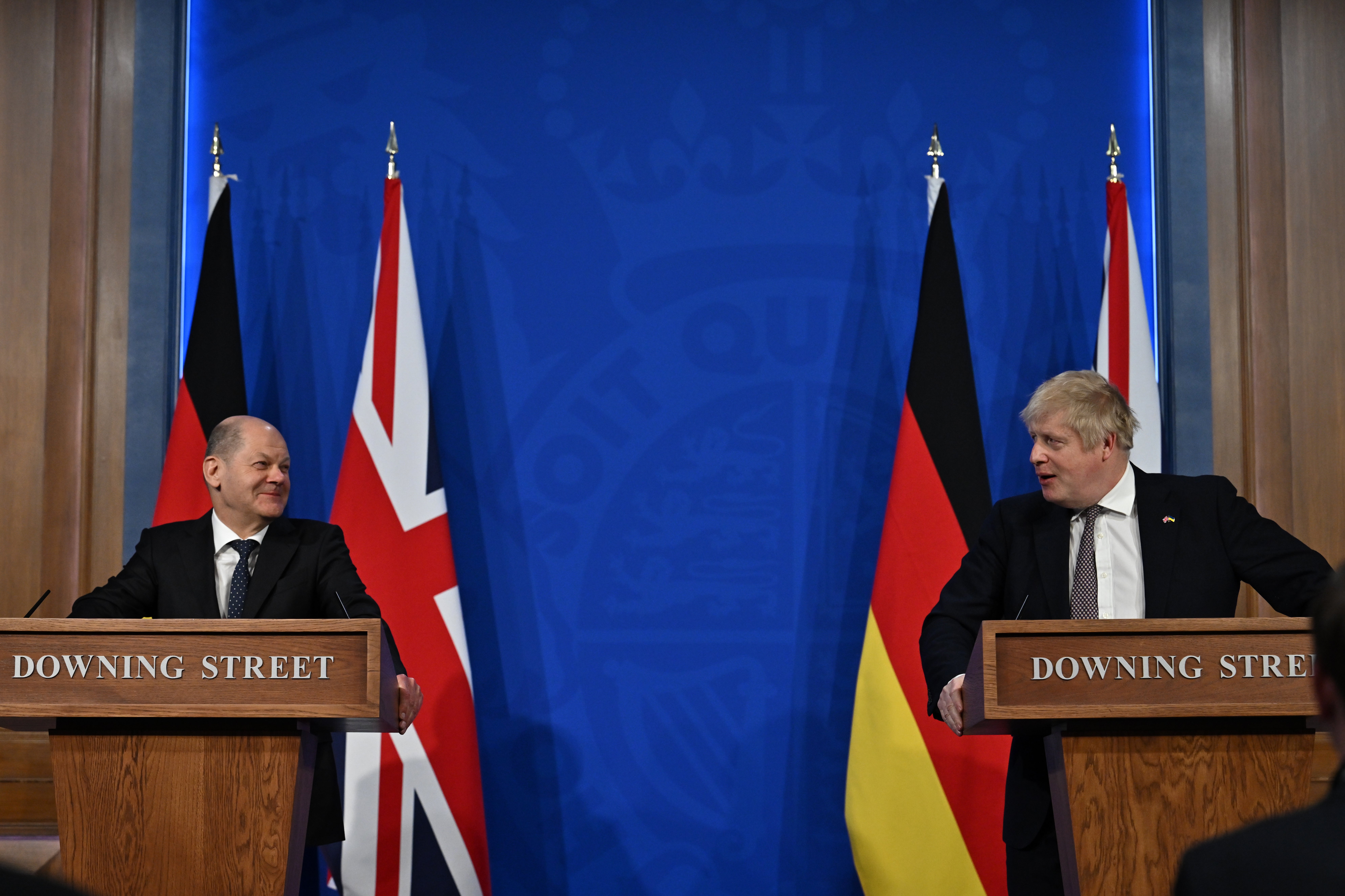 Olaf Scholz [L] and Boris Johnson [R] were targeted by the pro-Russia trolls