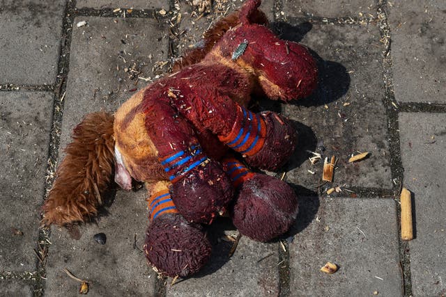 <p>A stuffed horse with bloodstains on it lies on a platform after Russian shelling at the railway station in Kramatorsk</p>