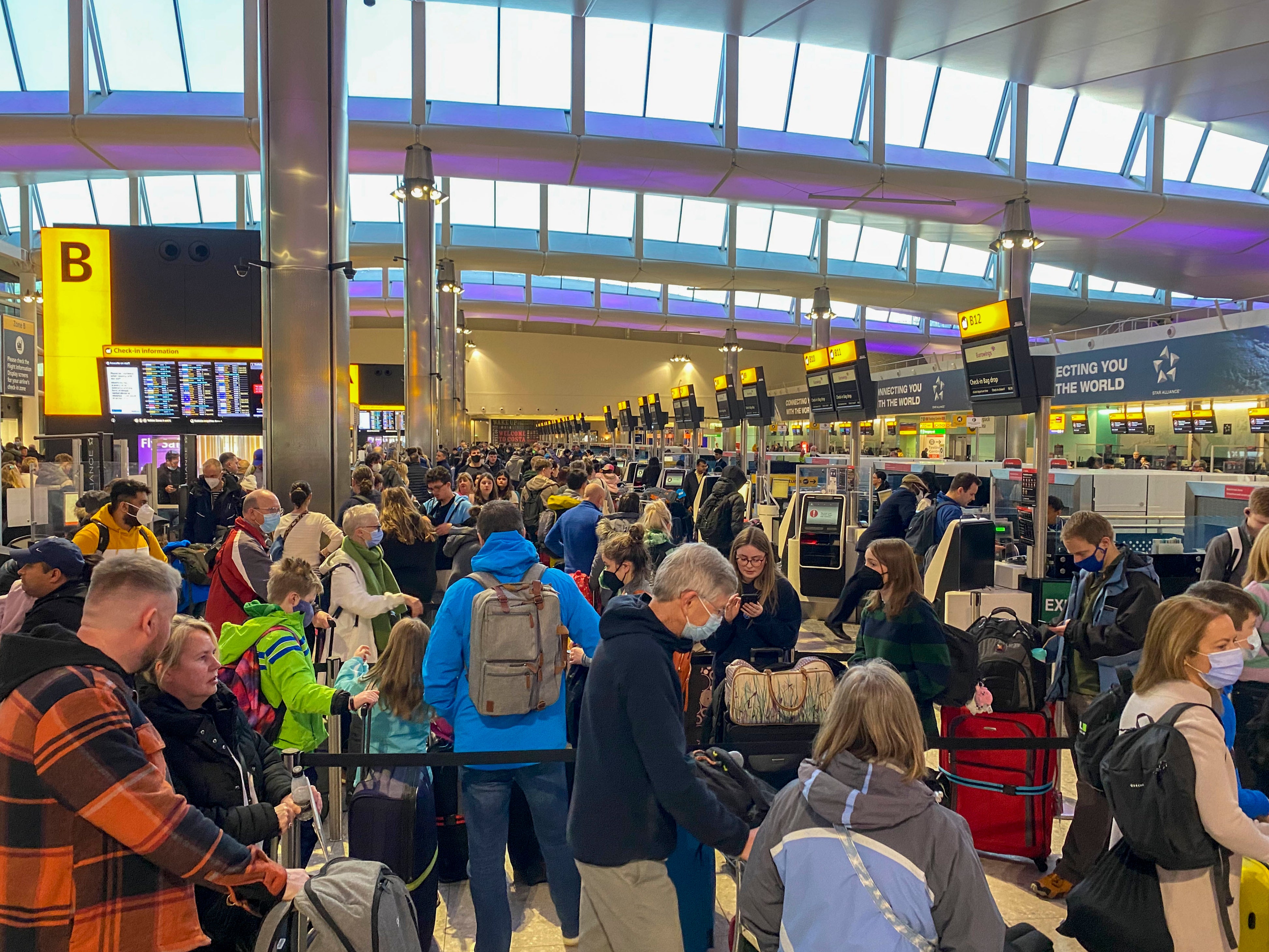 Passengers check-in in terminal 2 at Heathrow Airport, west London as the getaway starts in earnest as schools close for Easter