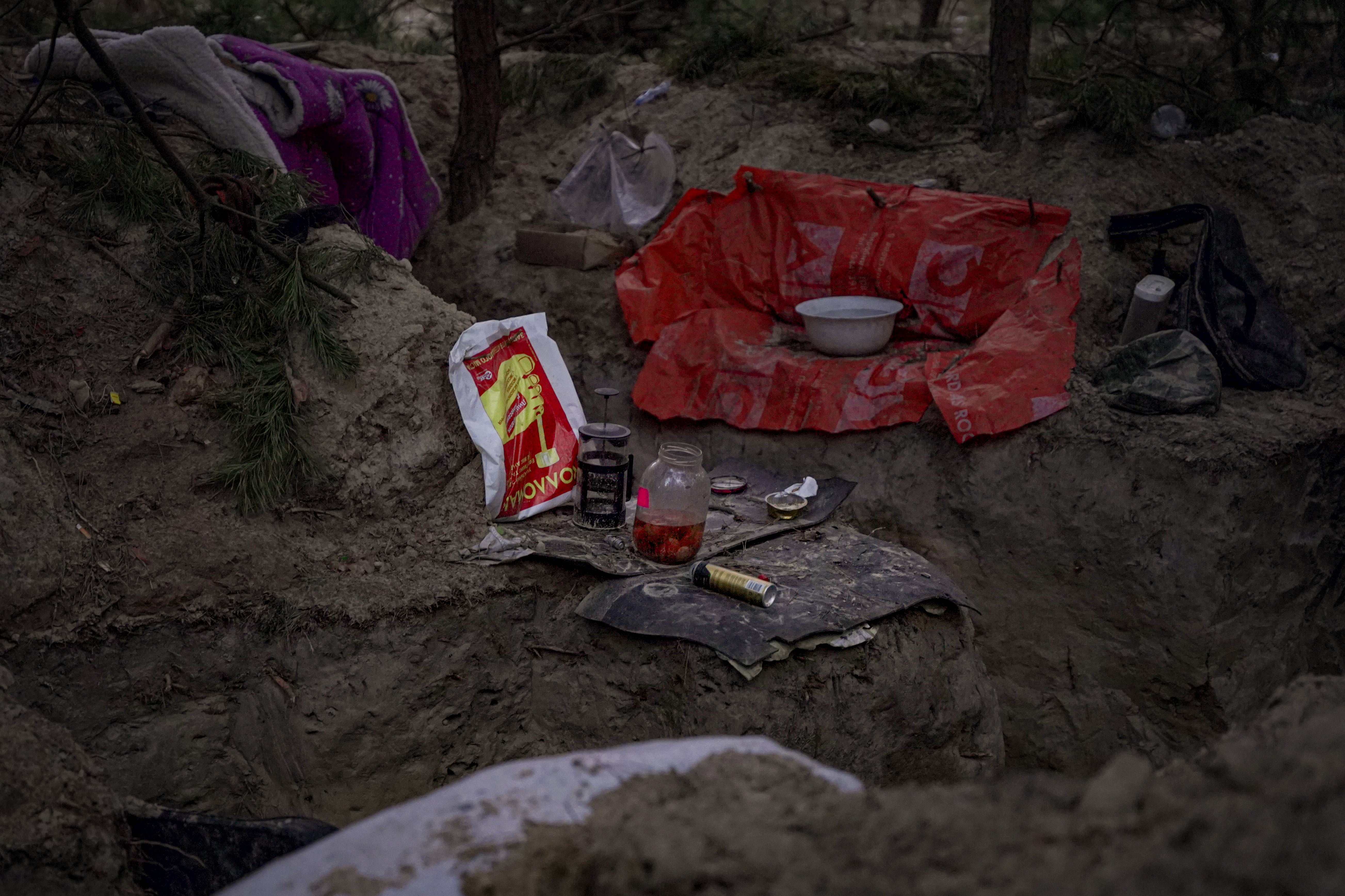 Russian soldiers left behind their cafetiere, among the debris of their camp near Makariv
