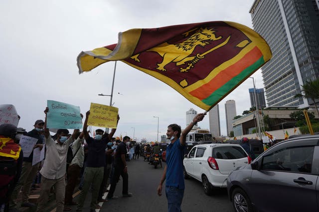 <p>Sri Lankans protest demanding the resignation of president Gotabaya Rajapaksa and his government in Colombo on 9 April</p>