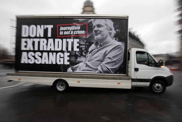 A van with an advert supporting Julian Assange (Jonathan Brady/PA)