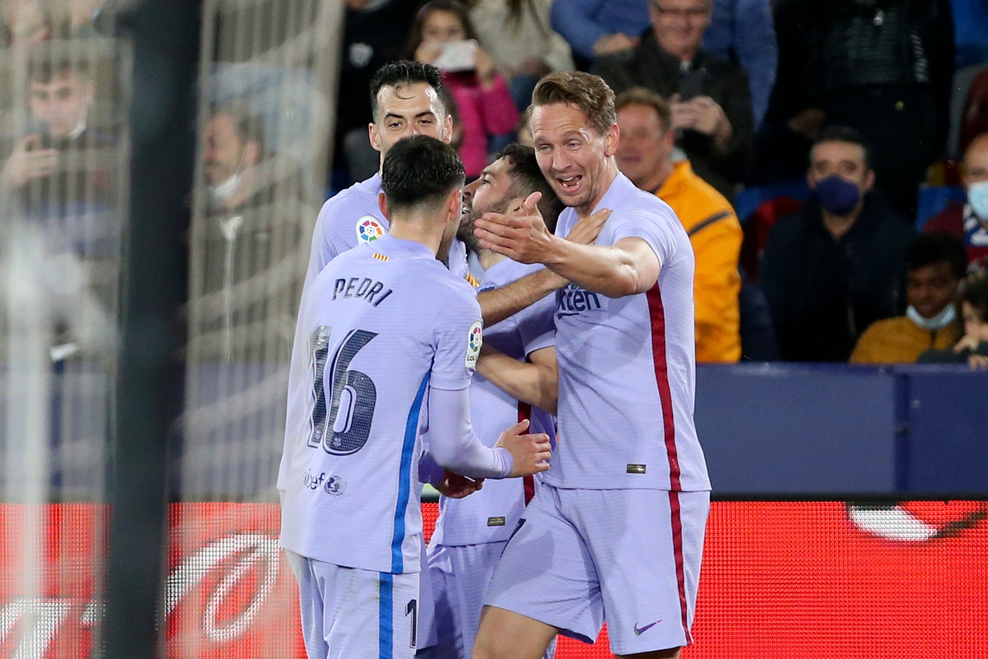 Barcelona’s Luuk de Jong (right) celebrates his stoppage time winner against Levante (Alberto Saiz/AP)
