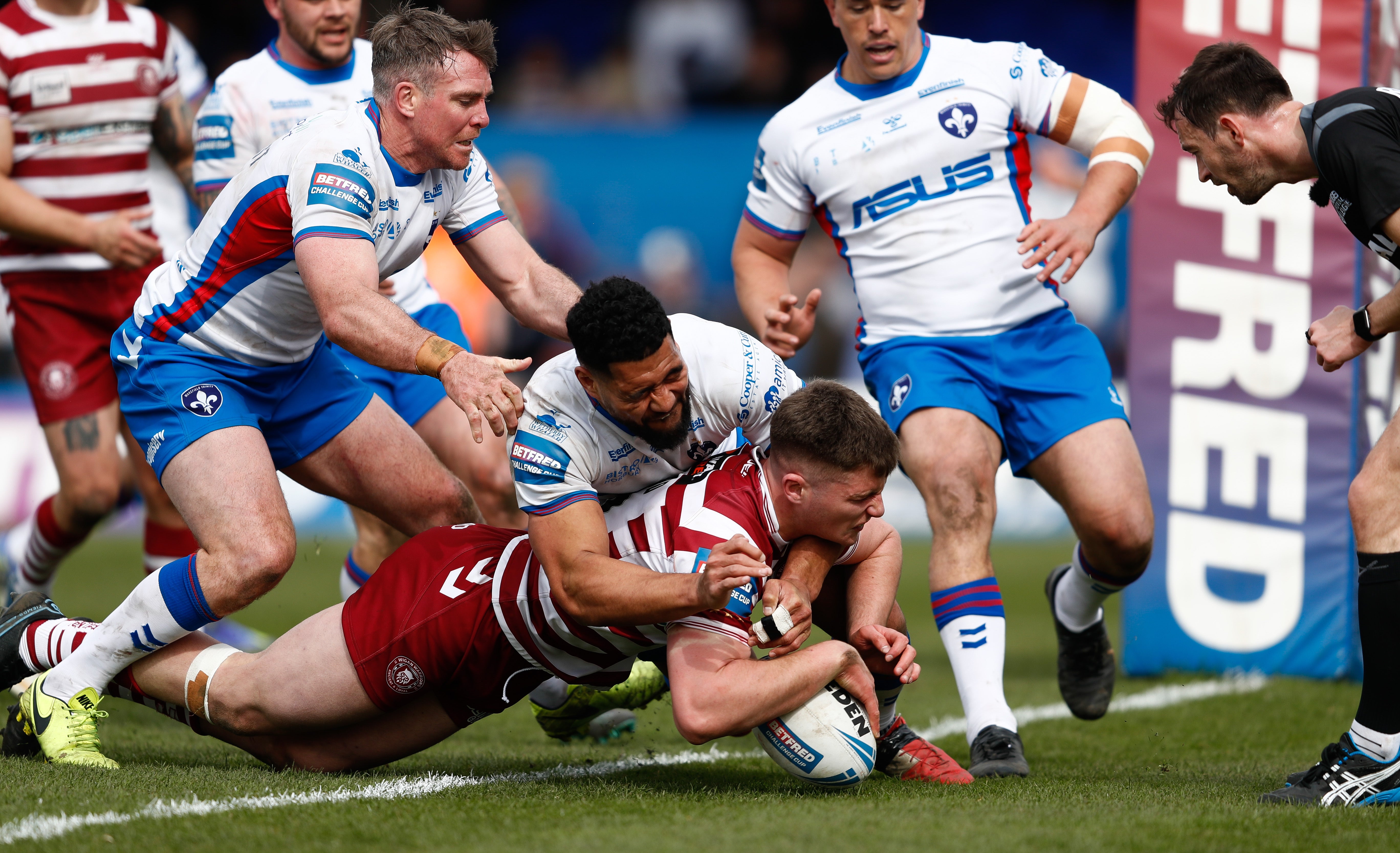 Ethan Havard dives in for a try during Wigan’s 36-6 Challenge Cup quarter-final win against Wakefield (Will Matthews/PA)