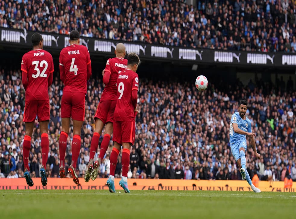 Manchester City’s Riyad Mahrez takes a free-kick that hits a post in Sunday’s Premier League clash with title rivals Liverpool (Martin Rickett/PA)