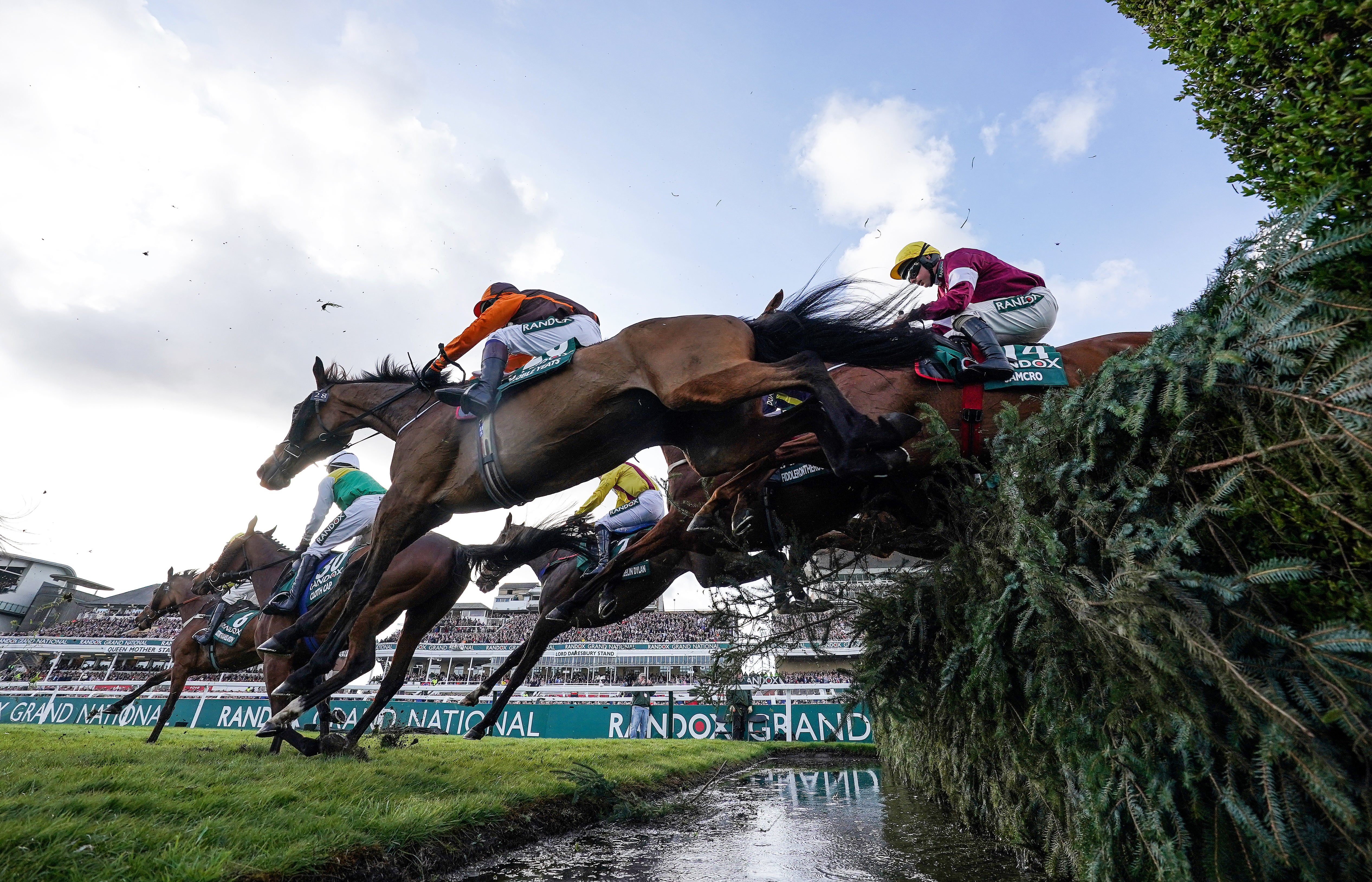Noble Yeats, a 50-1 outsider ridden by Sam Waley-Cohen, at the water-jump on their way to victory in the Grand National at Aintree (David Davies/PA)