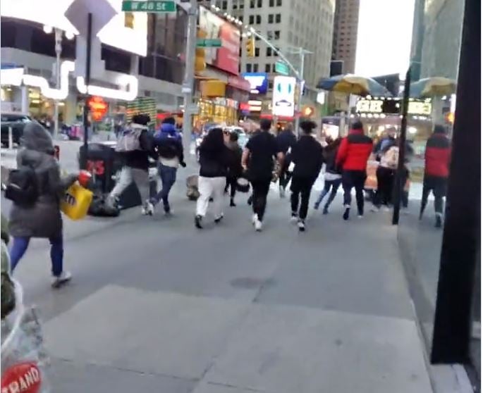 Screengrab from a video which shows people running after manhole explosion