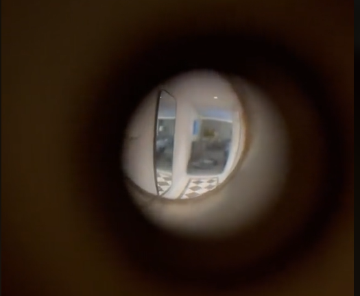 The hotel room peephole in Erin’s video