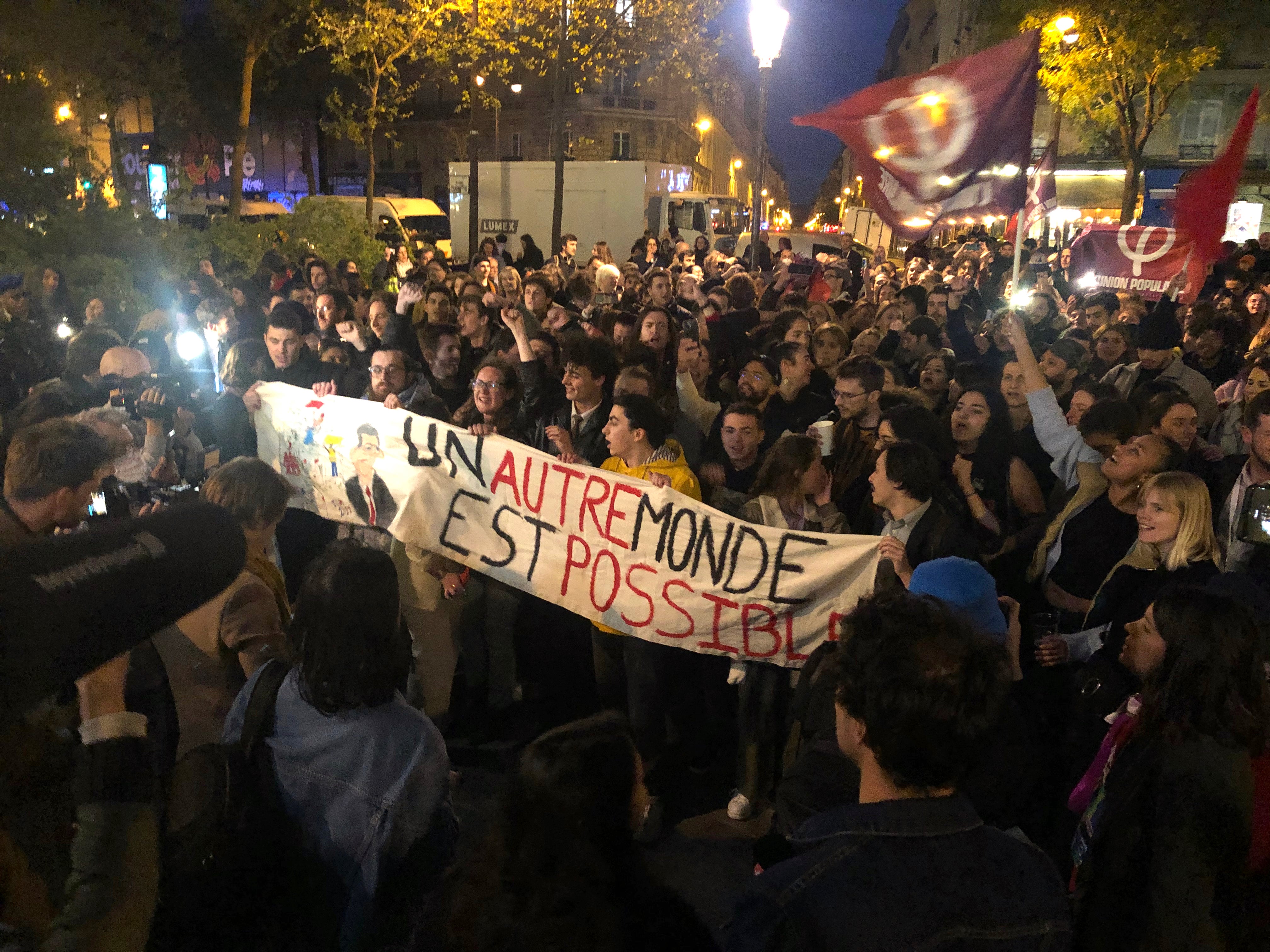 Supporters of third place finisher Jean-Luc Mélenchon, react following his loss, in Paris