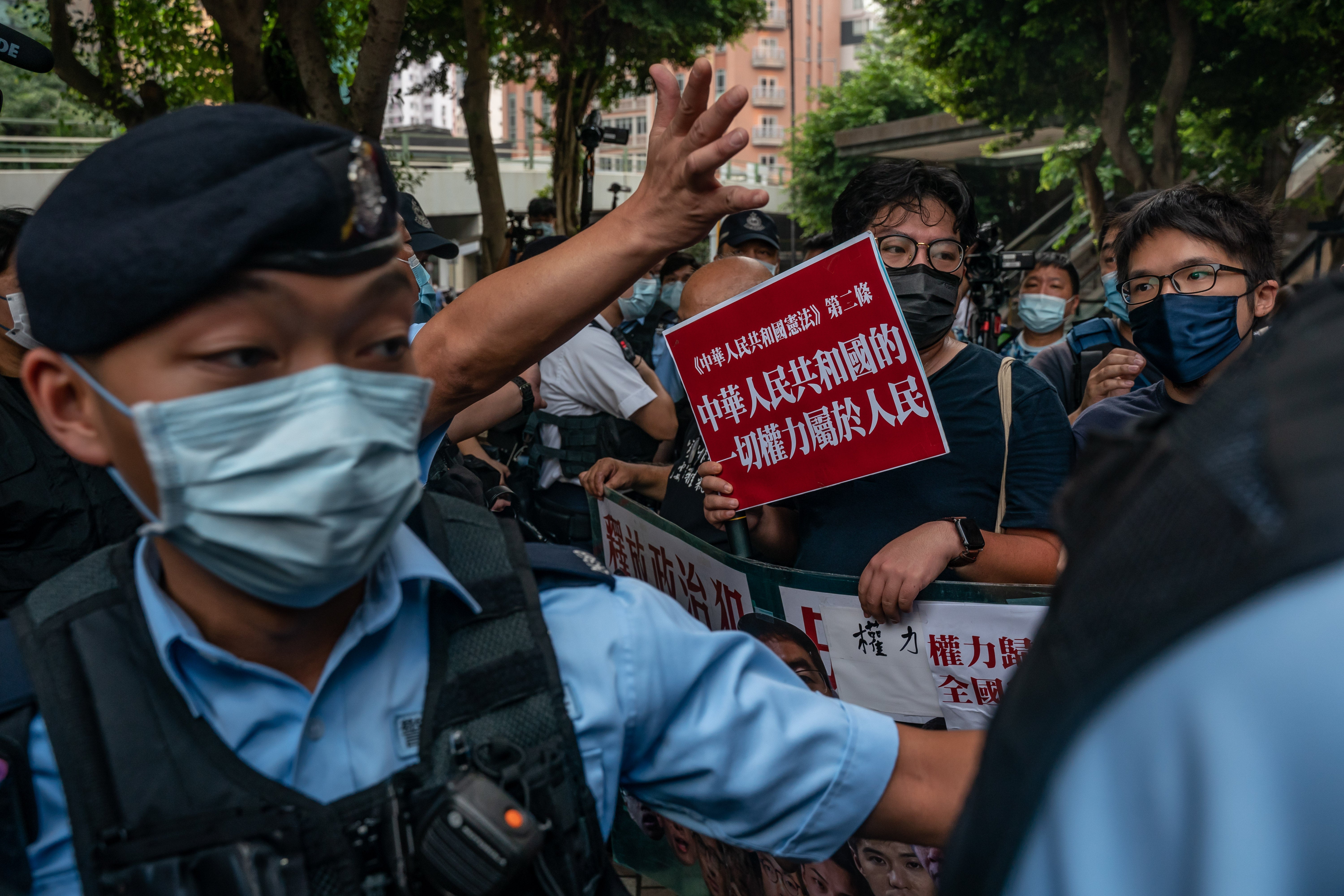 Police cordon off pro-democracy activists at a protest in the Wan Chai district