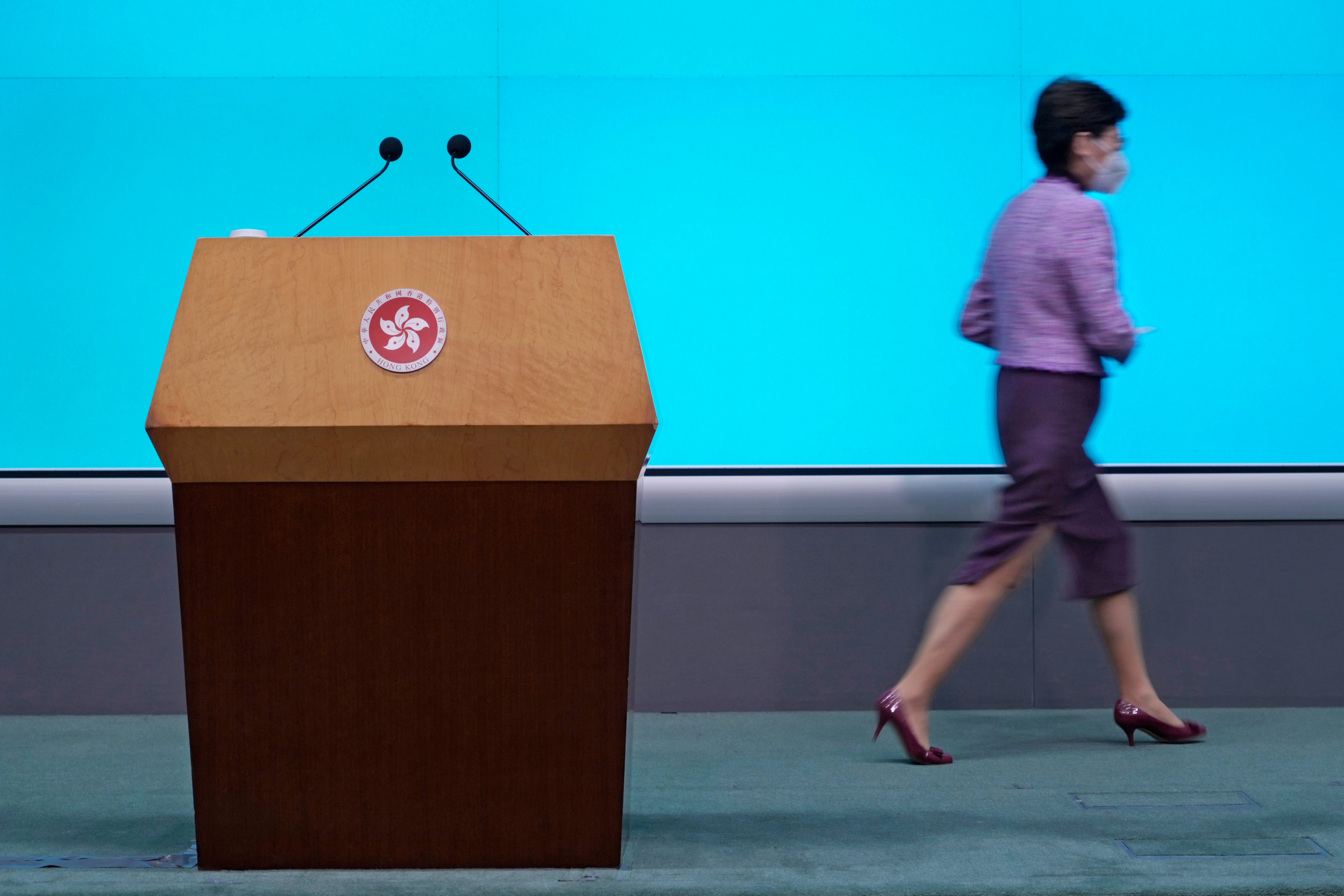 Lam leaves after a news conference where she announced she would not run for a second term