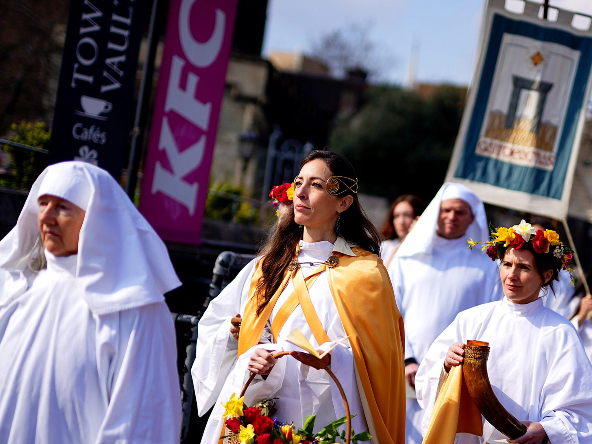 A druid spring equinox ceremony at Tower Hill Terrace in London, March 2022. Ceridwen, the earth mother, brings token seeds which are symbolically sown around a circle