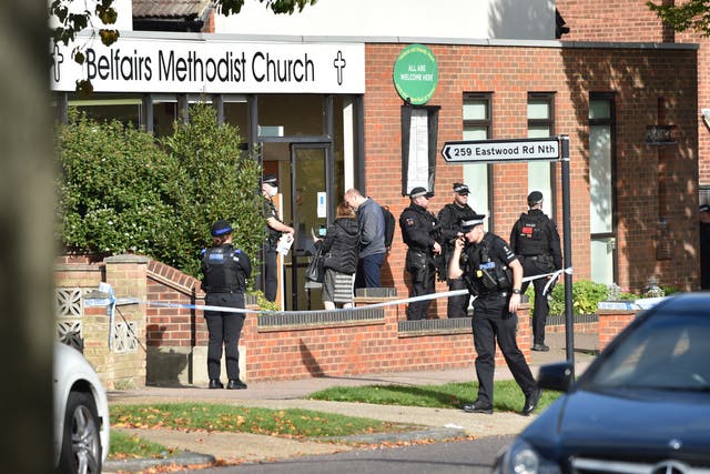 <p>Armed police officers outside Belfairs Methodist Church in Leigh-on-Sea, Essex, where Conservative MP Sir David Amess was stabbed to death in October </p>