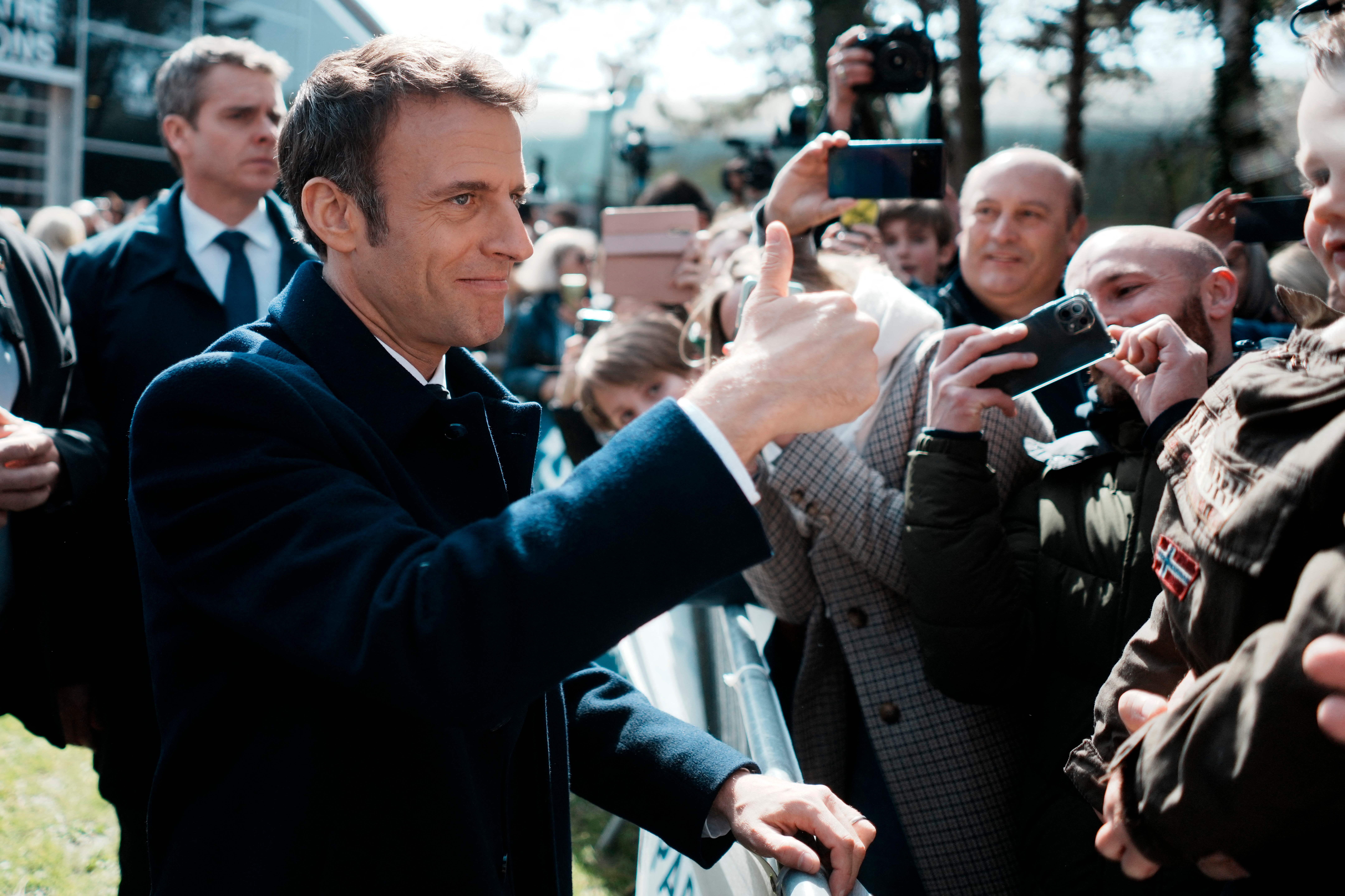 Macron gives the thumbs up after voting in the first round of France’s presidential election in Le Touquet