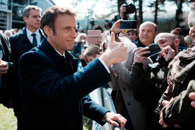 <p>Macron gives the thumbs up after voting in the first round of France’s presidential election in Le Touquet</p>