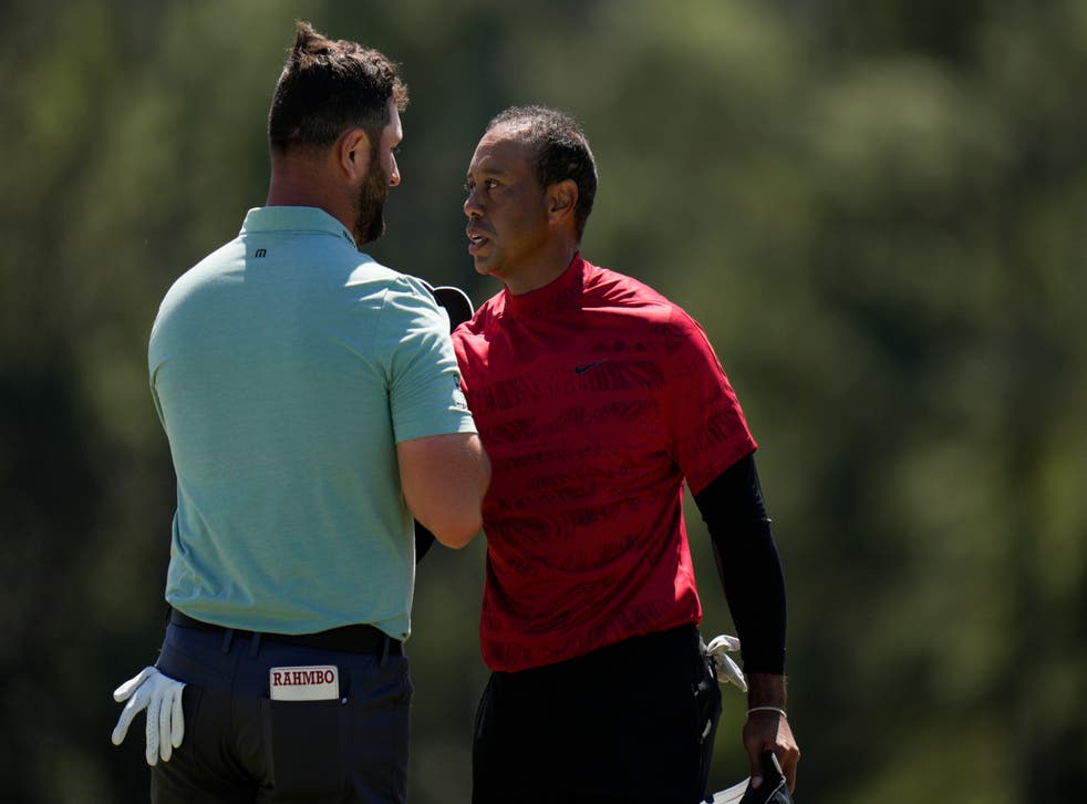 Jon Rahm (left) shakes hands with Tiger Woods after playing together in the final round of the Masters (Jae C. Hong/AP)