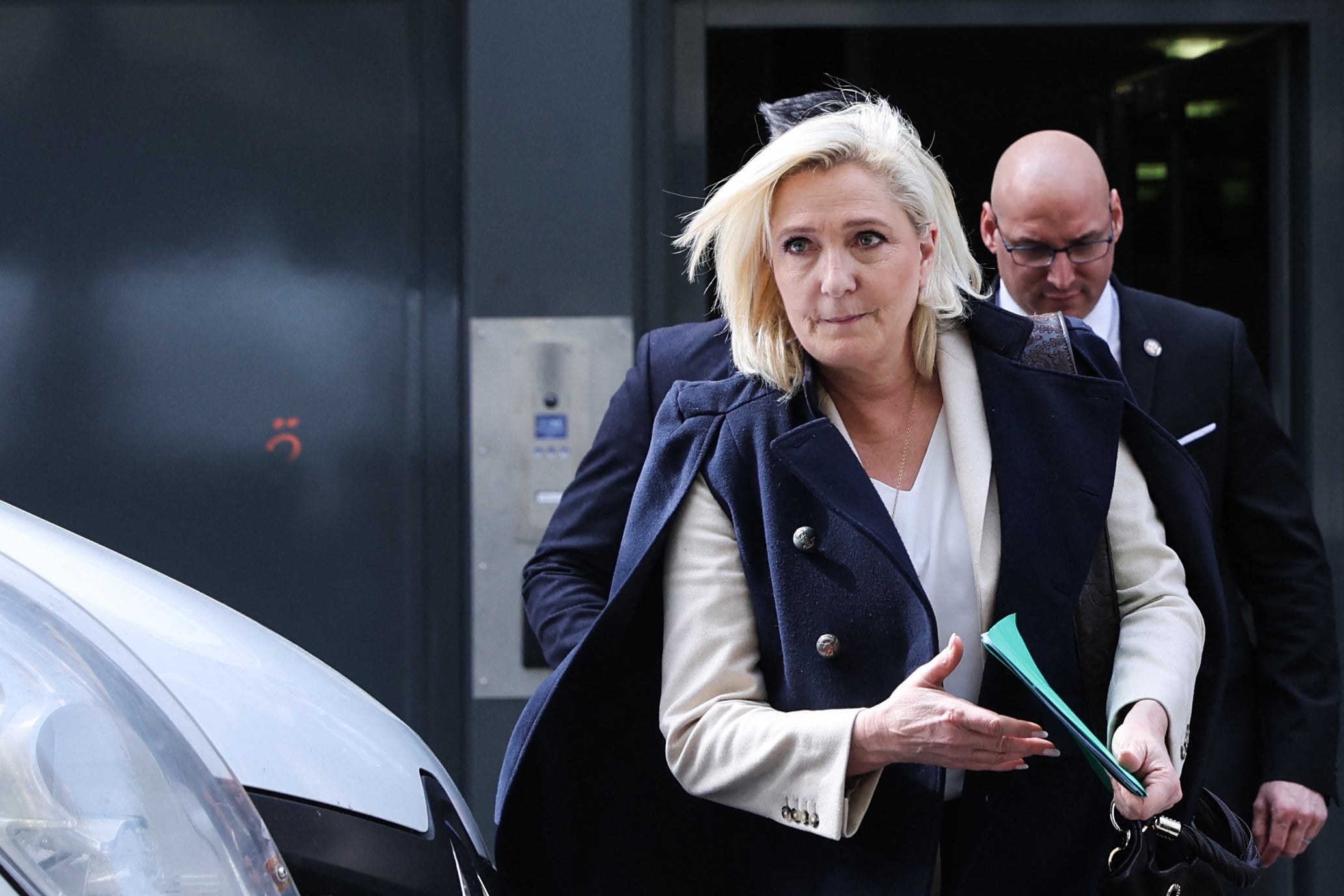 French far-right party presidential candidate Marine Le Pen leaves after a meeting with her campaign staff members in Paris