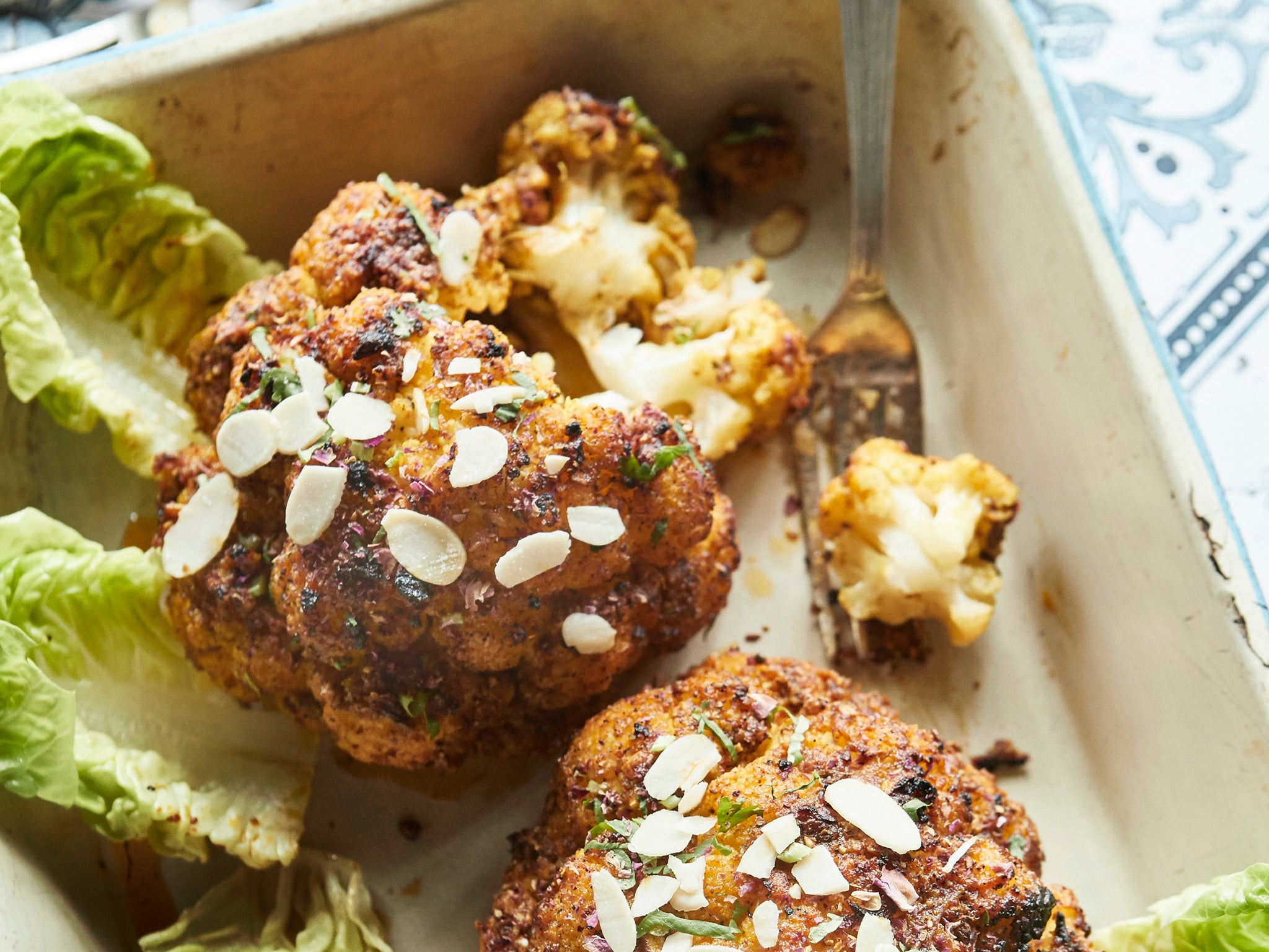 Although it’s typically served with meat or seafood, you could make it a veggie main with a whole cauliflower
