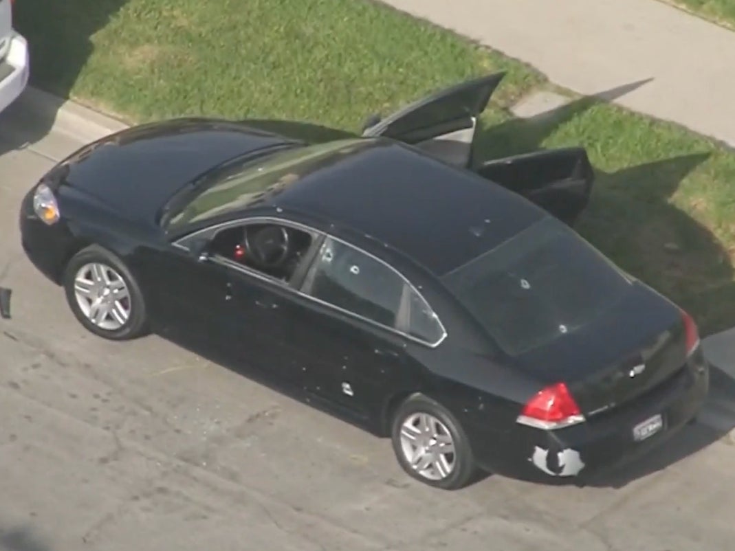 A car is seen riddled with bulletholes after a shooting in Willowbrook, California, on Sunday 10 April