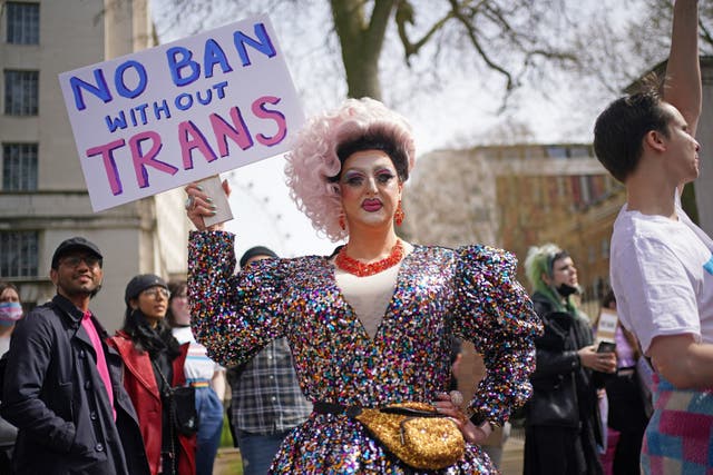 People take part in a protest outside Downing Street in London, over transgender people not being included in plans to ban conversion therapy