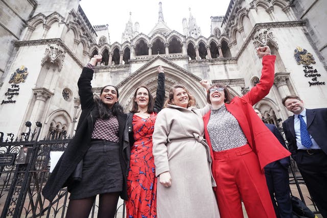 Reclaim These Streets founders (left to right) Henna Shah, Jamie Klingler, Anna Birley and Jessica Leigh celebrate outside the Royal Courts of Justice, London (Yui Mok/PA)