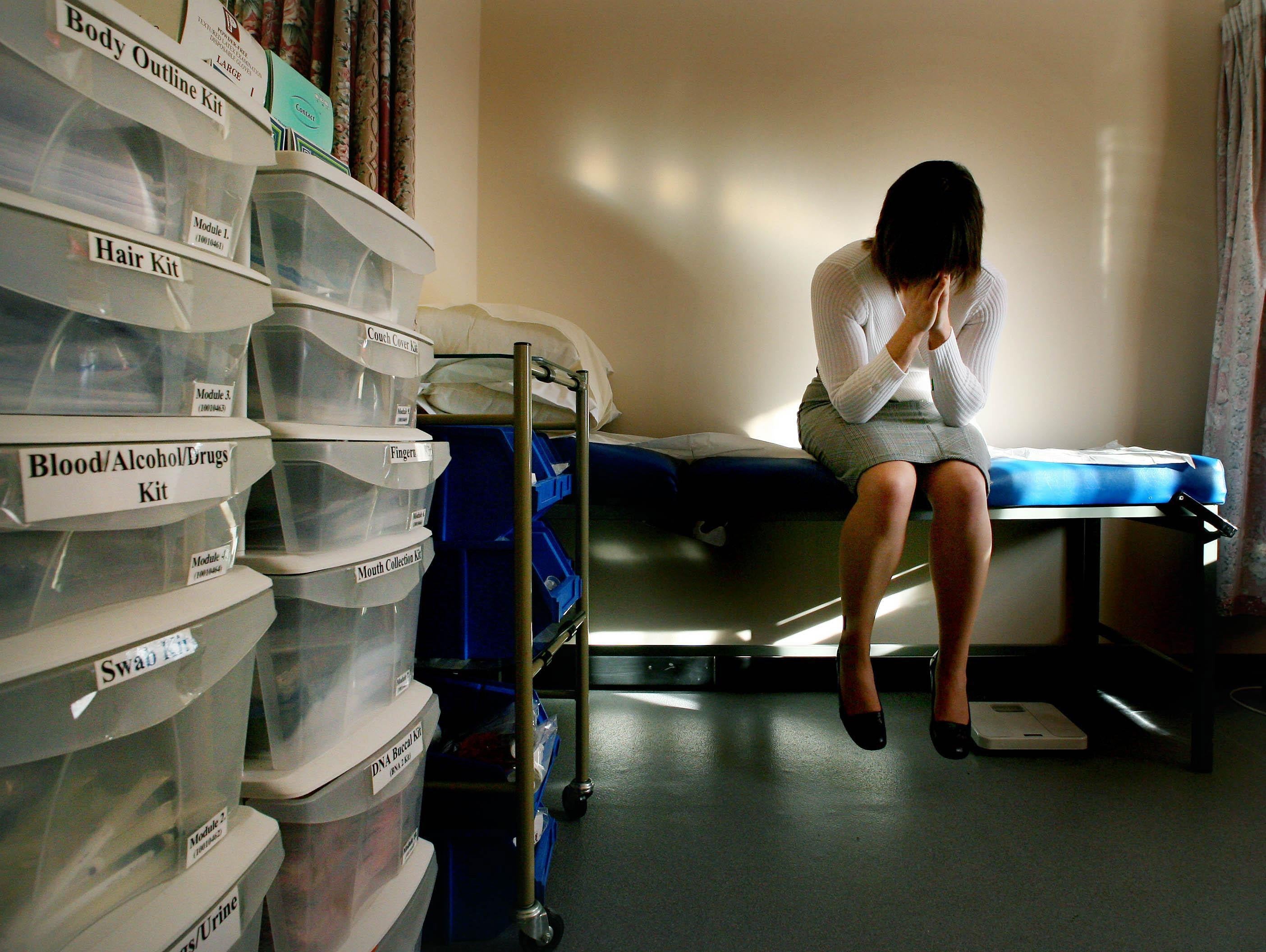 In a picture posed by a model a rape victim waits to be seen by a doctor at a specialist rape clinic (Gareth Fuller/PA)
