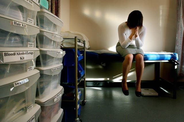 In a picture posed by a model a rape victim waits to be seen by a doctor at a specialist rape clinic (Gareth Fuller/PA)