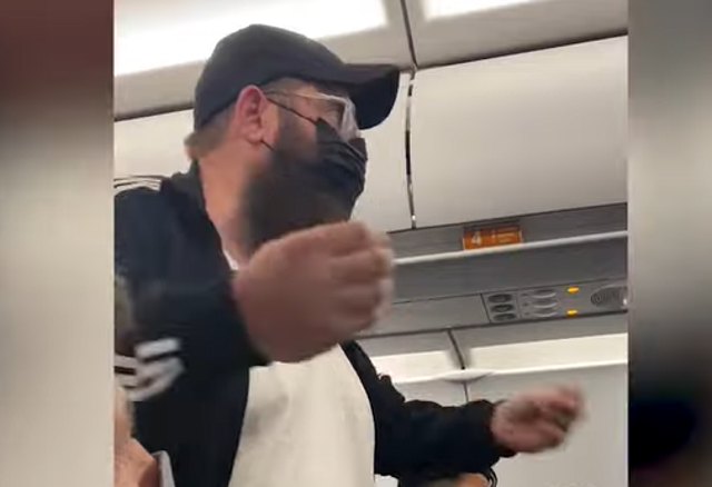 <p>The masked man pleads with JetBlue crew to get off the plane</p>