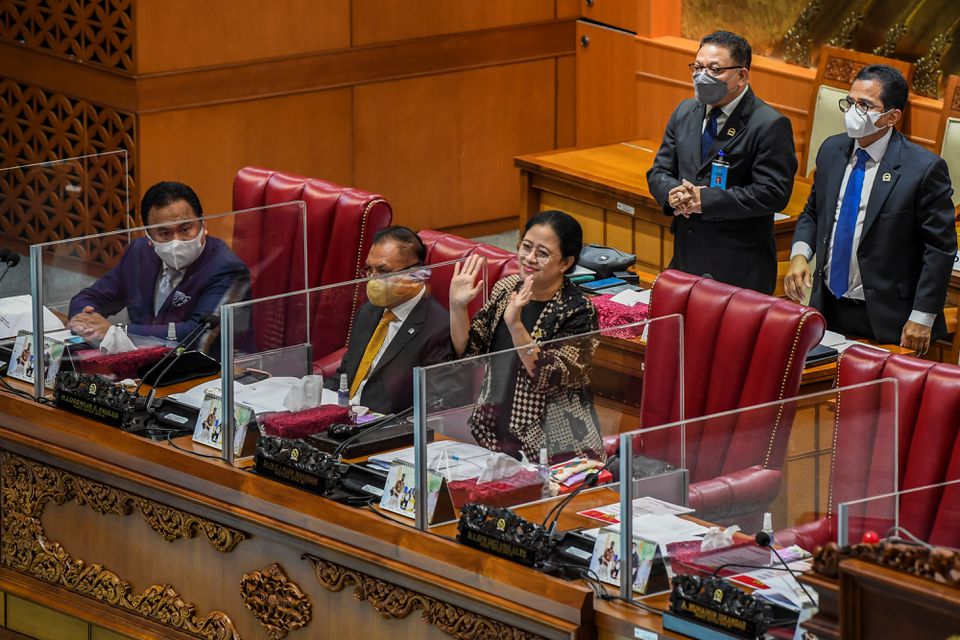 Speaker of the House Puan Maharani waves after Indonesia’s parliament passed a bill to tackle sexual violence, in Jakarta, Indonesia