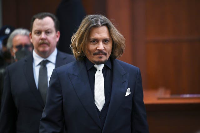 <p>Actor Johnny Depp walks into the courtroom at the Fairfax County Circuit Court 12 April 2022</p>