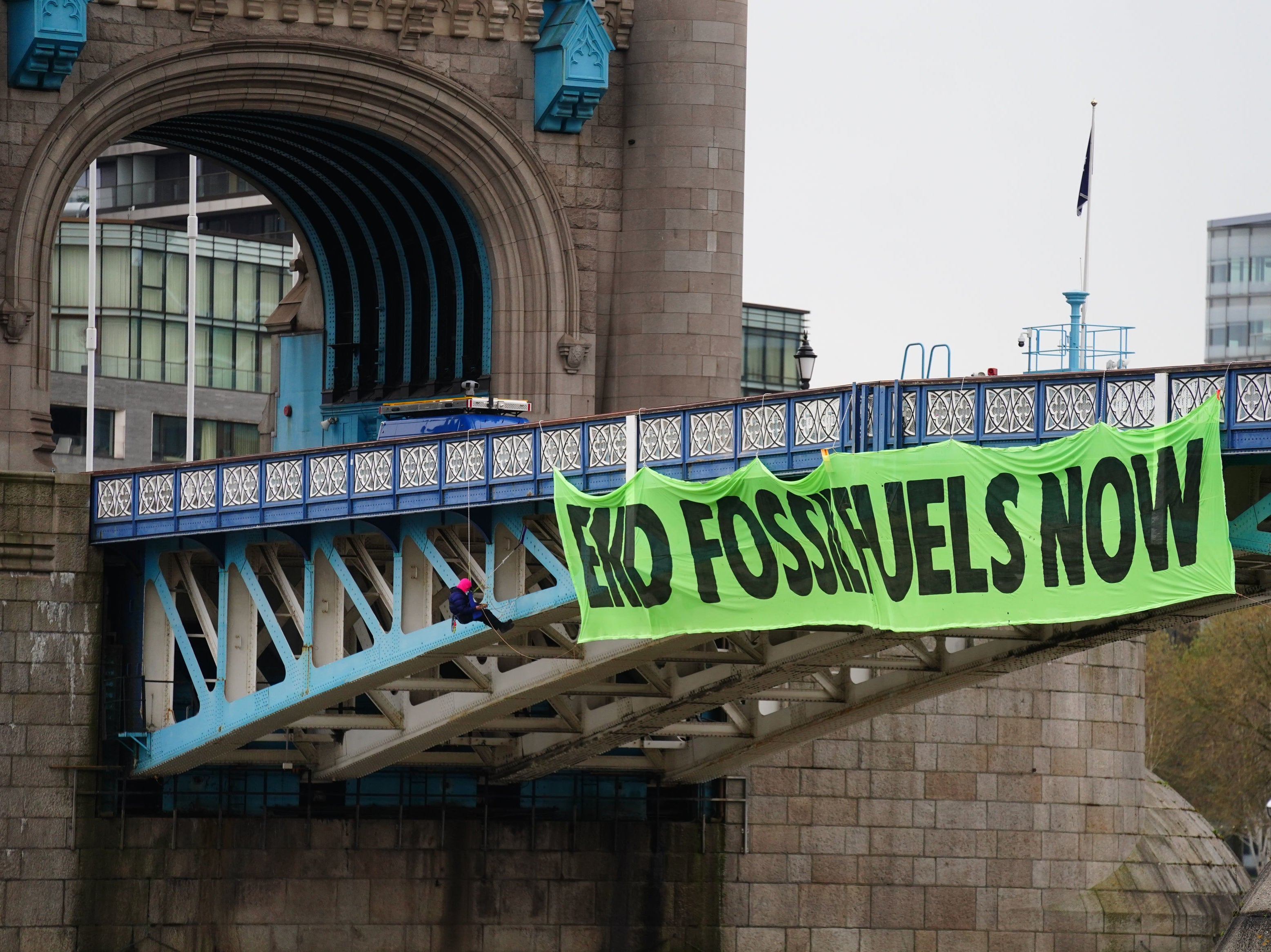<p>Activists closed Tower Bridge on Friday and suspended a giant banner reading ‘End Fossil Fuels Now’</p>
