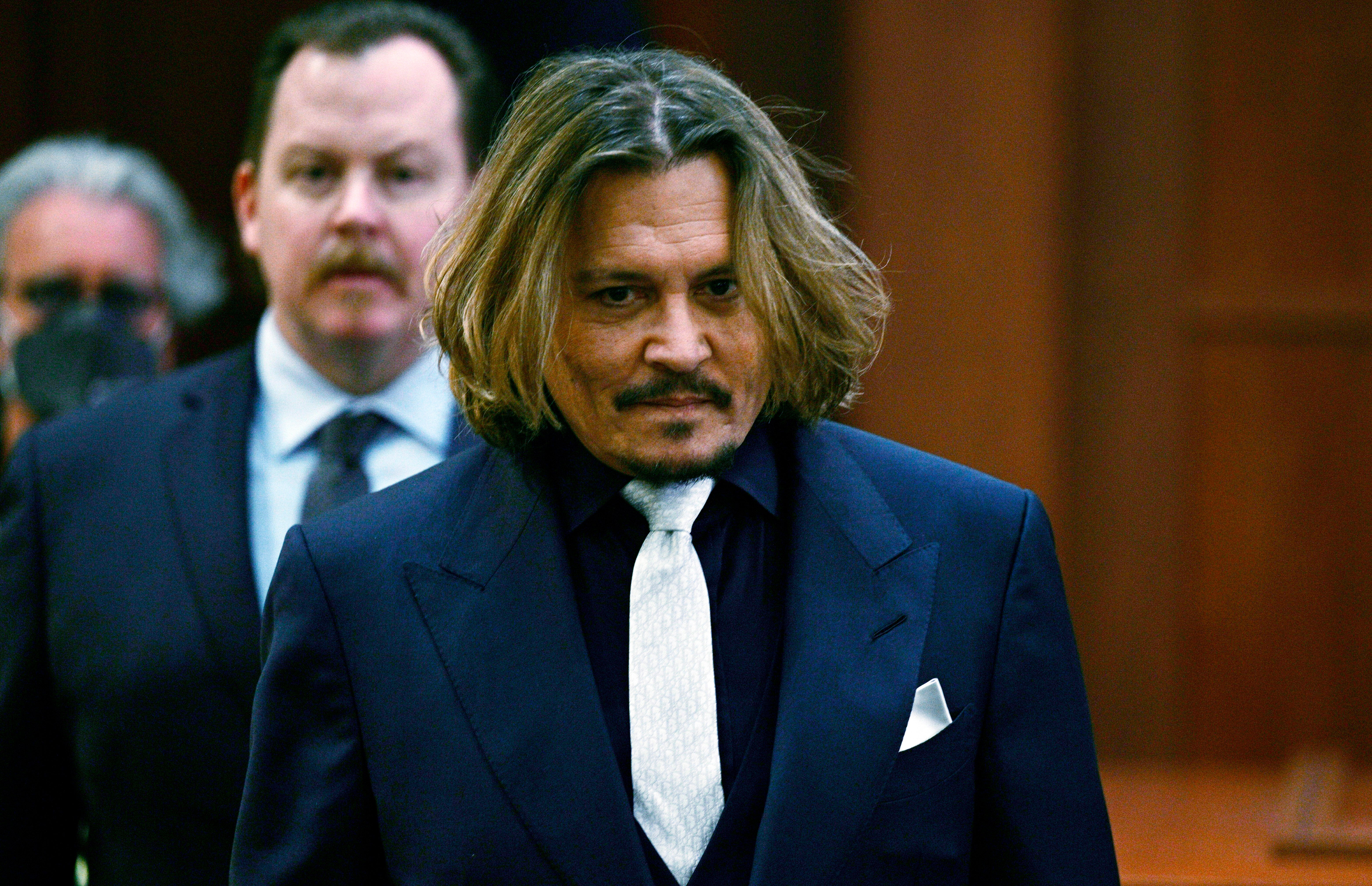 Actor Johnny Depp walks into the courtroom at the Fairfax County Circuit Court in Fairfax, Virginia (Brendan Smialowski, Pool via AP)