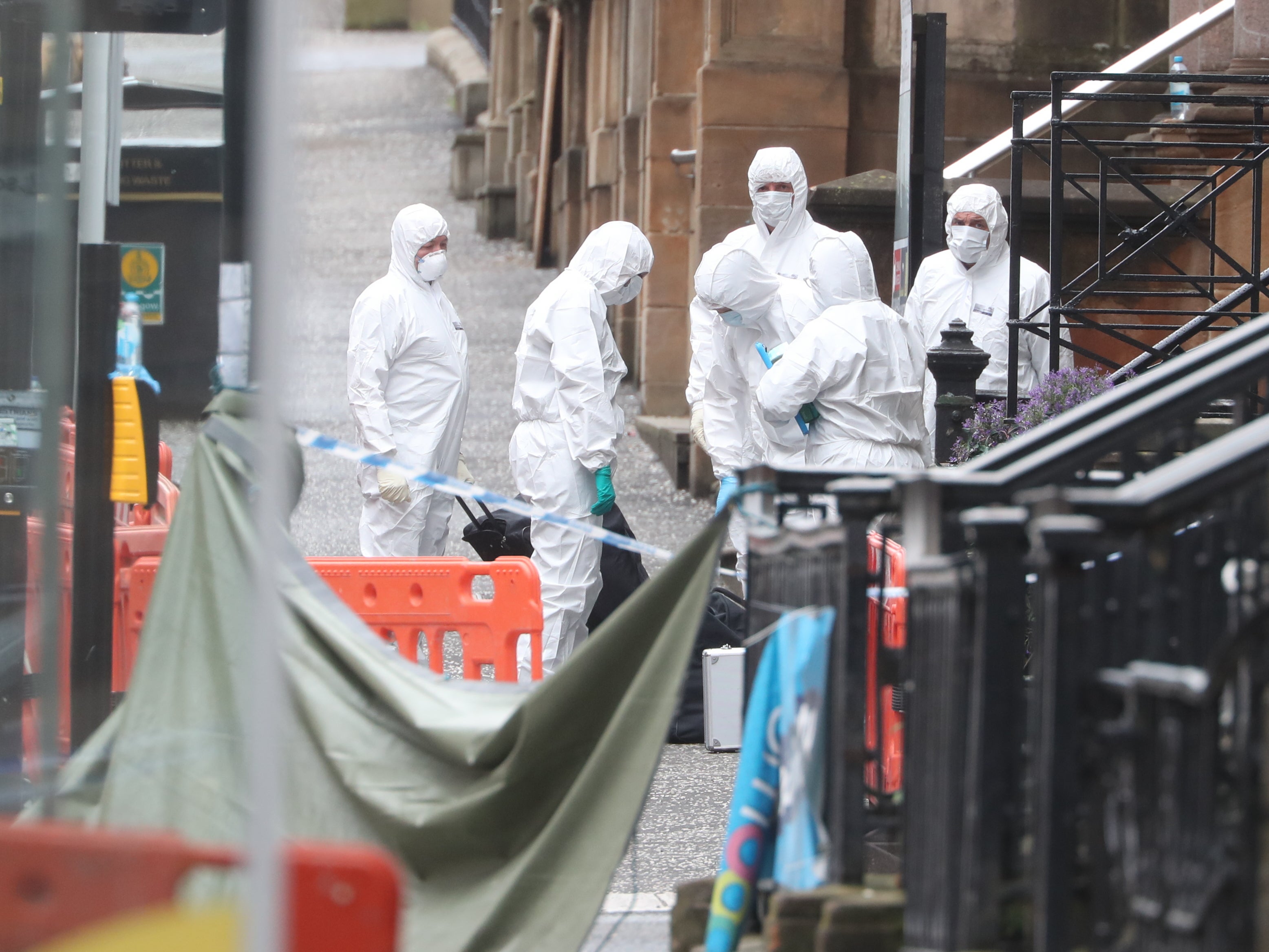 Forensic officers at the scene in West George Street, Glasgow, where Adam was shot dead by armed officers