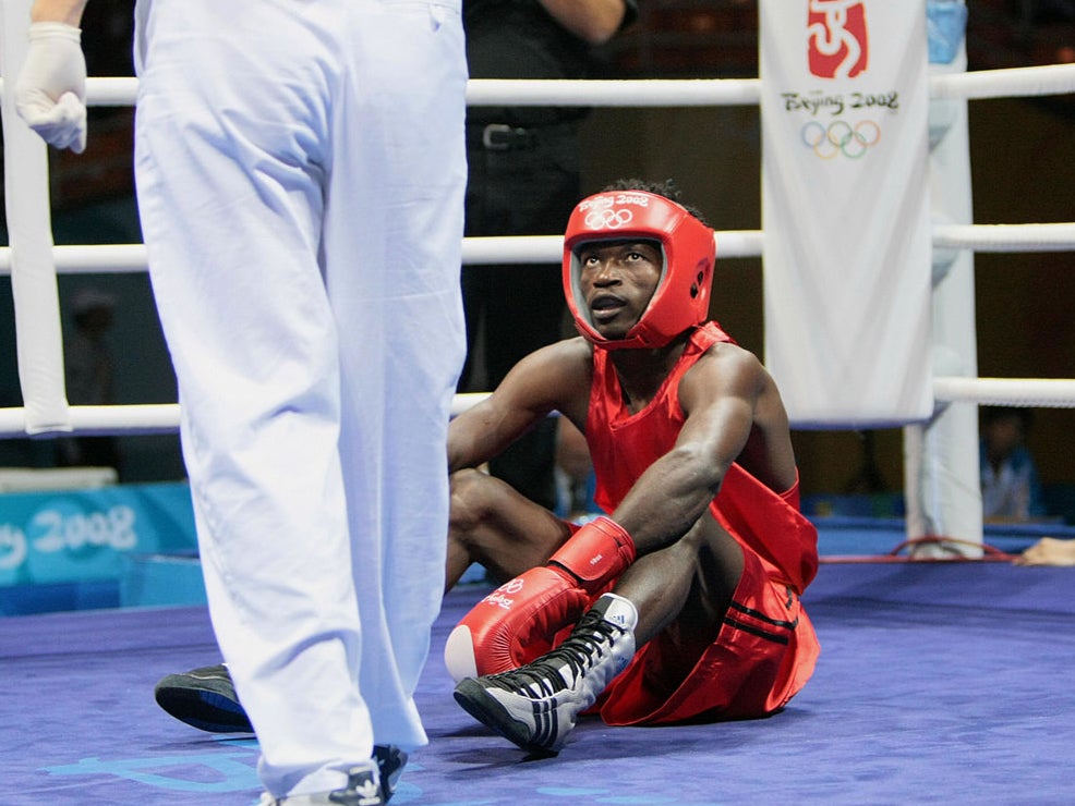 Essomba is knocked down at the 2008 Olympics in Beijing