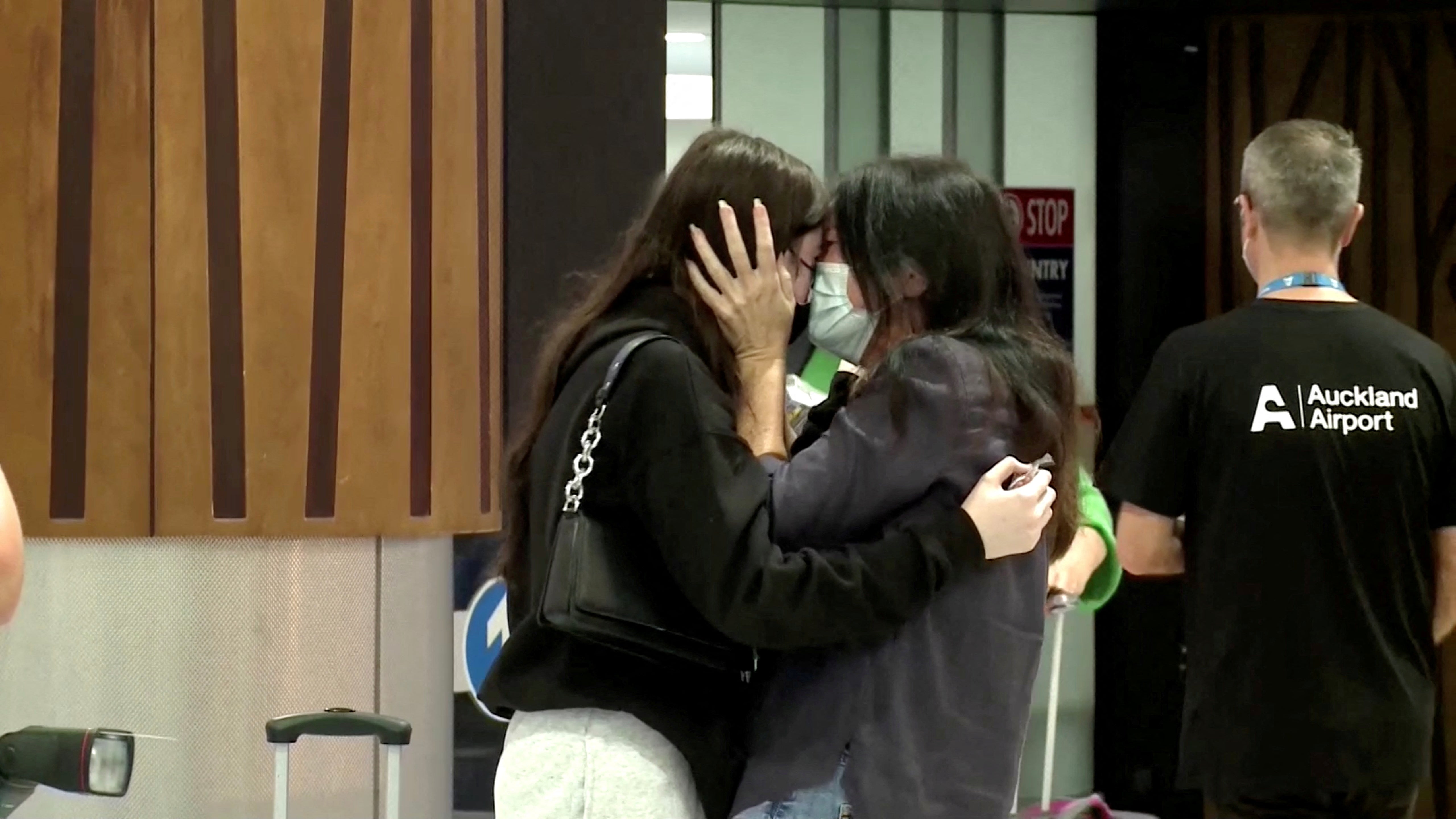 Emotional loved ones greet each other at Auckland Airport