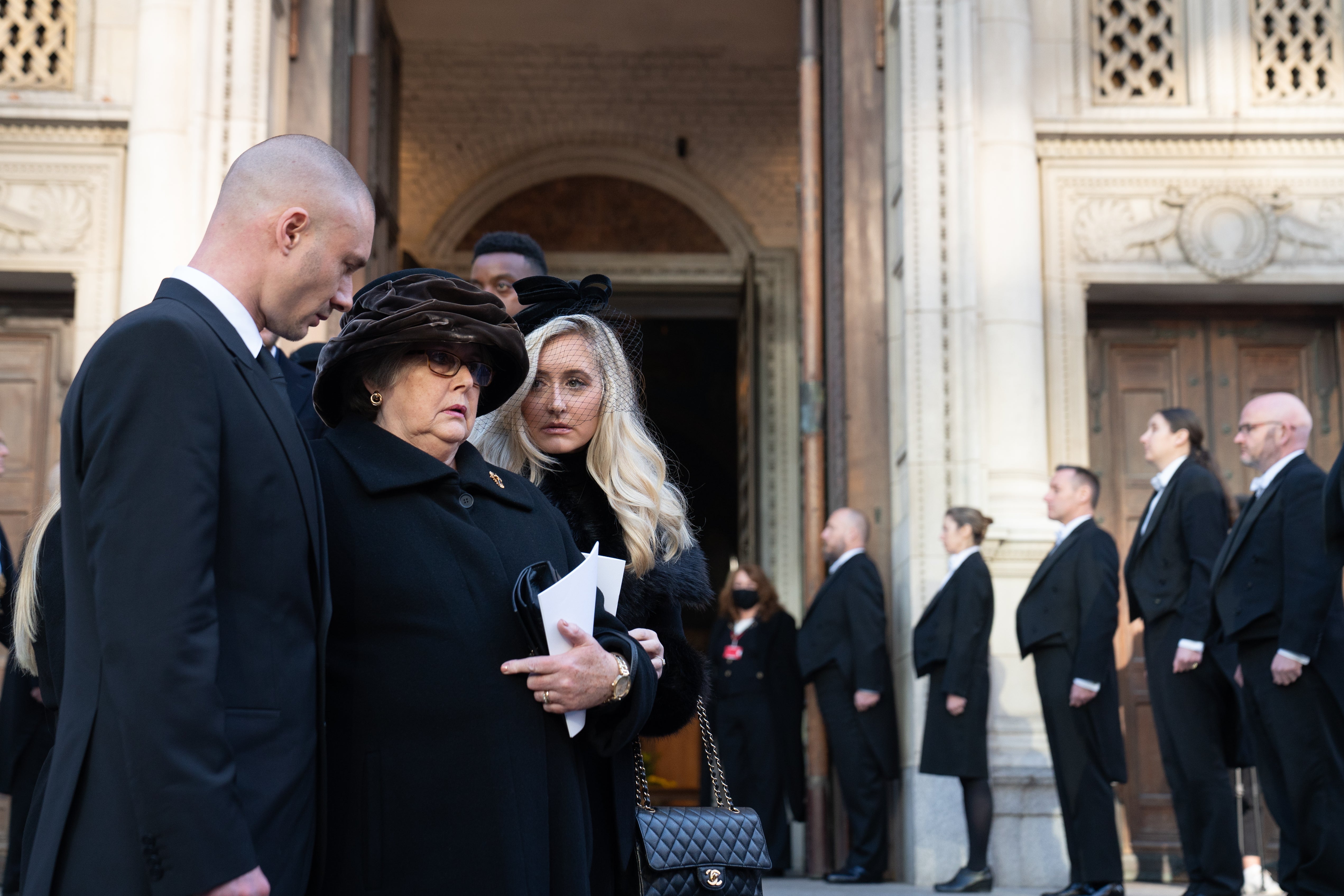 Julia Amess (centre), the widow of Sir David, is comforted by her family following the requiem mass for Sir David at Westminster Cathedral