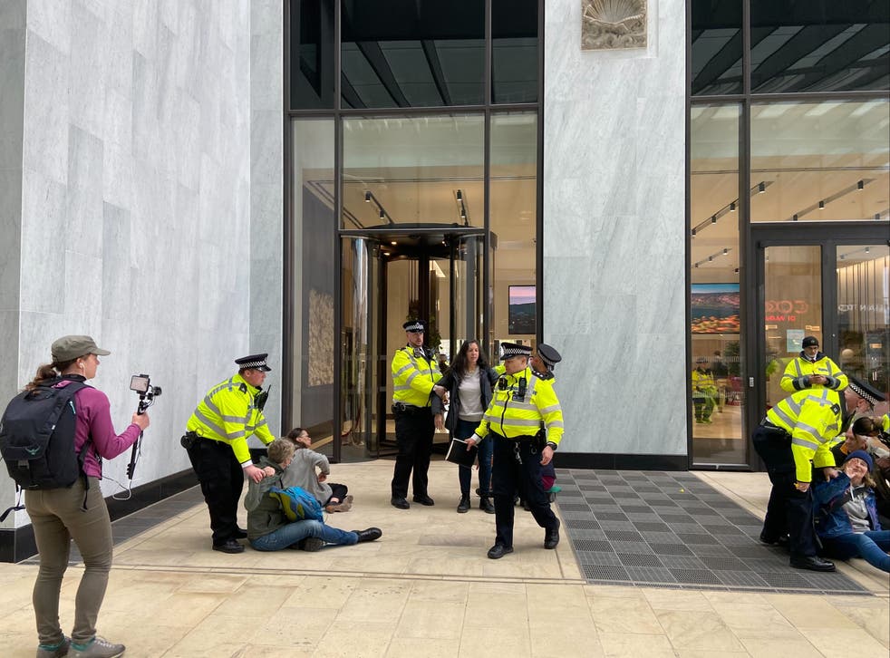 <p>XR protesters enter the Shell building in London</p>