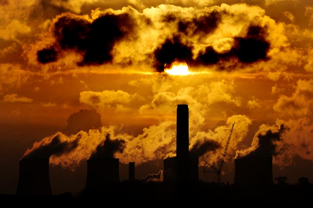Sunset over a power station (Rui Vieira/PA)