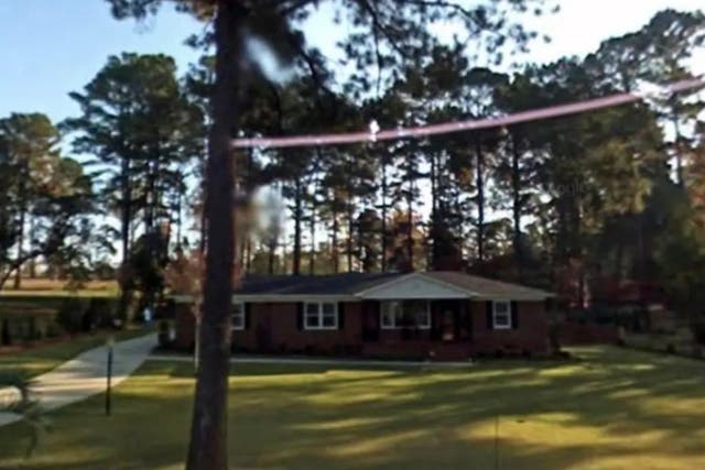 <p>The Thacker home just outside of Augusta National Golf Club in Georgia. The home was built by Herman and Elizabeth Thacker in 1959, and the couple refused to sell it to Augusta for years. Ms Thacker remains in the house to this day.</p>