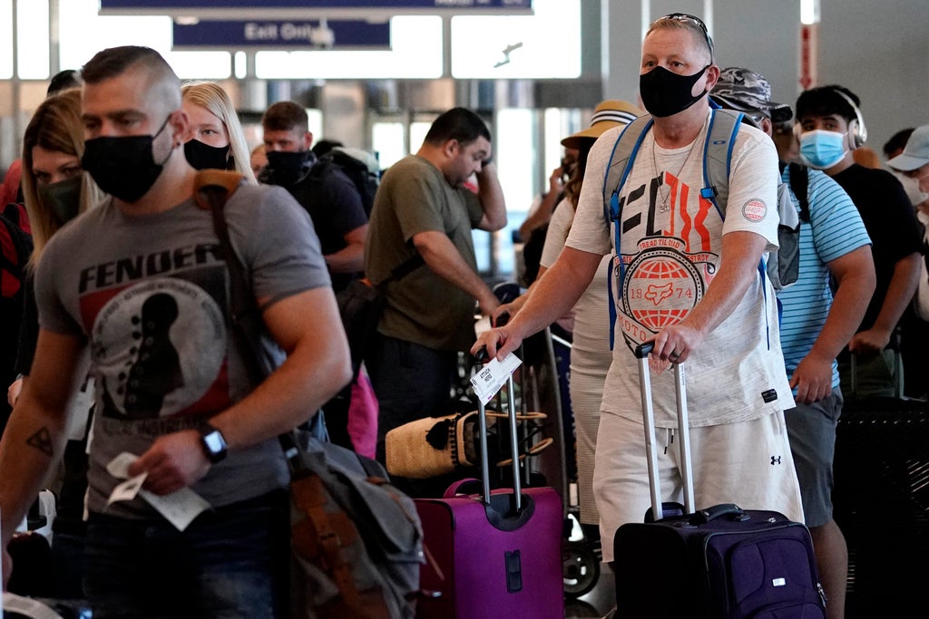Biden administration to extend travel mask mandate as CDC monitors uptick in Covid-19 cases, report says
