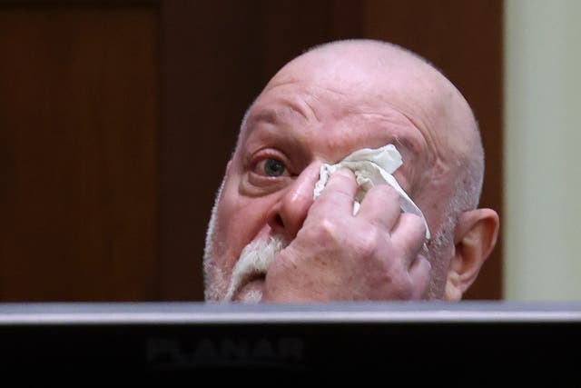 <p>Johnny Depp’s friend, Isaac Baruch, wipes tears as he testifies during the $50m Amber Heard defamation trial </p>