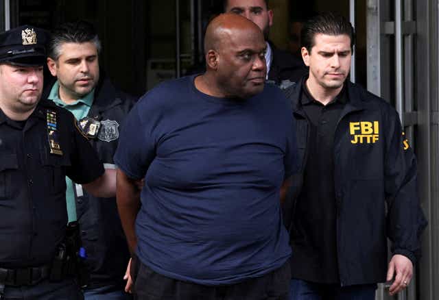 <p>Frank James, the suspect in the Brooklyn subway shooting walks outside a police precinct in New York City</p>