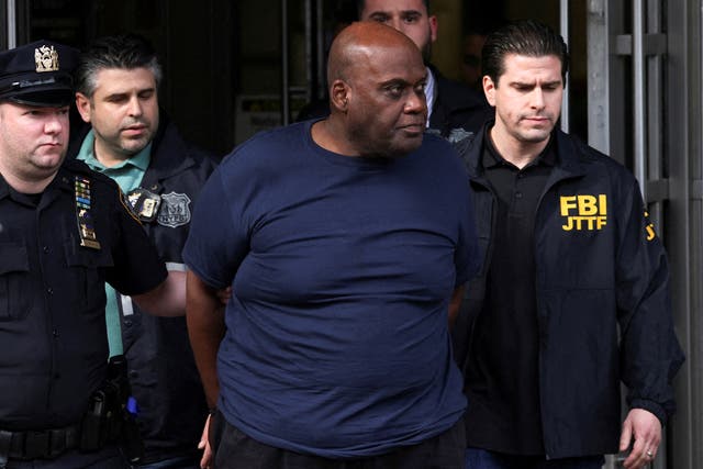 <p>Frank James, the suspect in the Brooklyn subway shooting walks outside a police precinct in New York City</p>