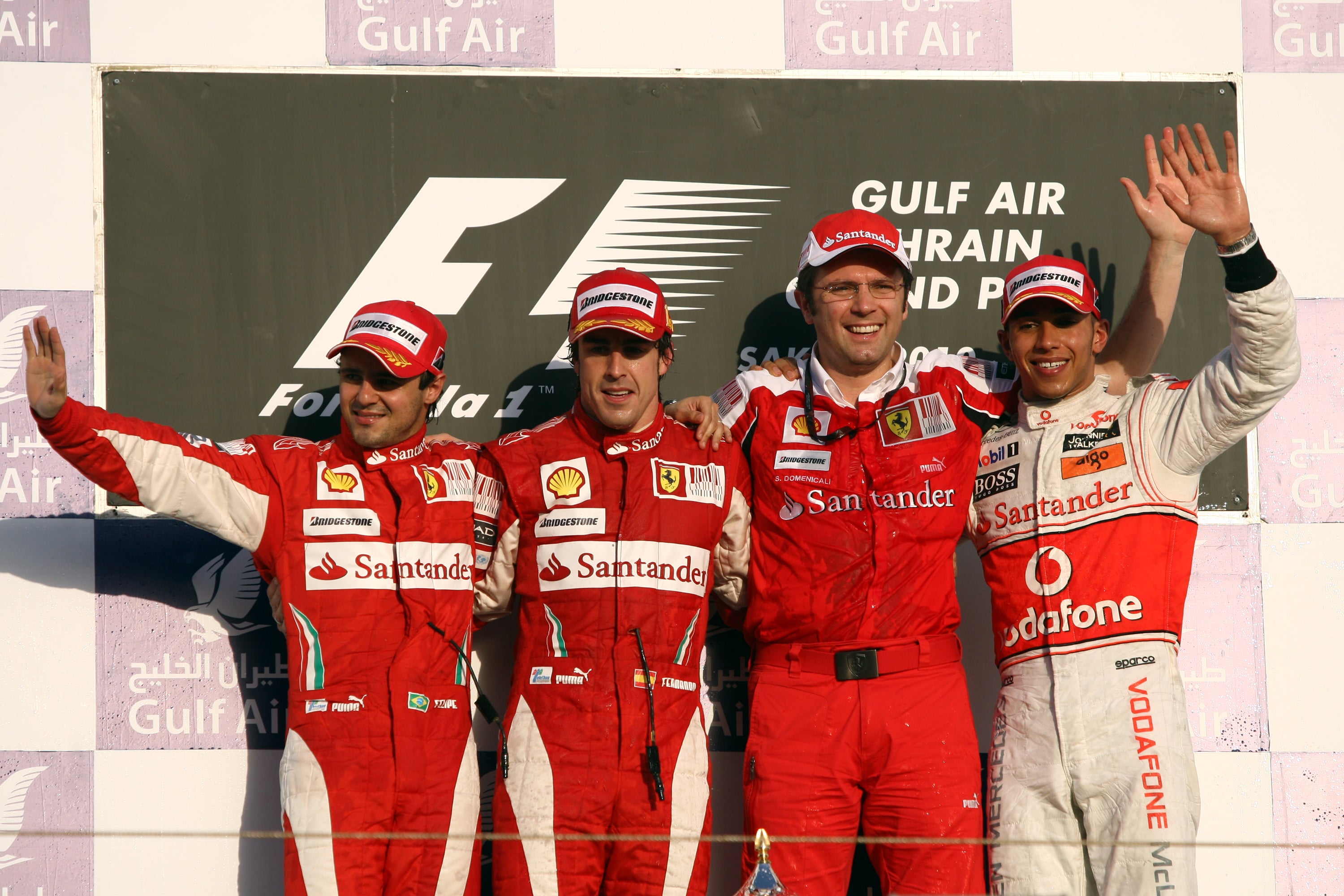 Ferrari’s Fernando Alonso (second left), Felipe Massa (left) and team principal Stefano Domenicali pose alongside McLaren’s Lewis Hamilton after the 2010 Bahrain Grand Prix (David Davies/PA)