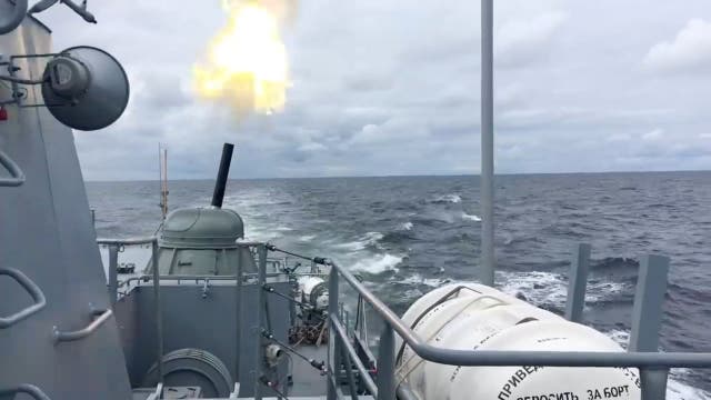 <p>A view shows a warship of the Russian Navy during artillery fire drills in the Baltic Sea, in this still image taken from video released on 27 January</p>