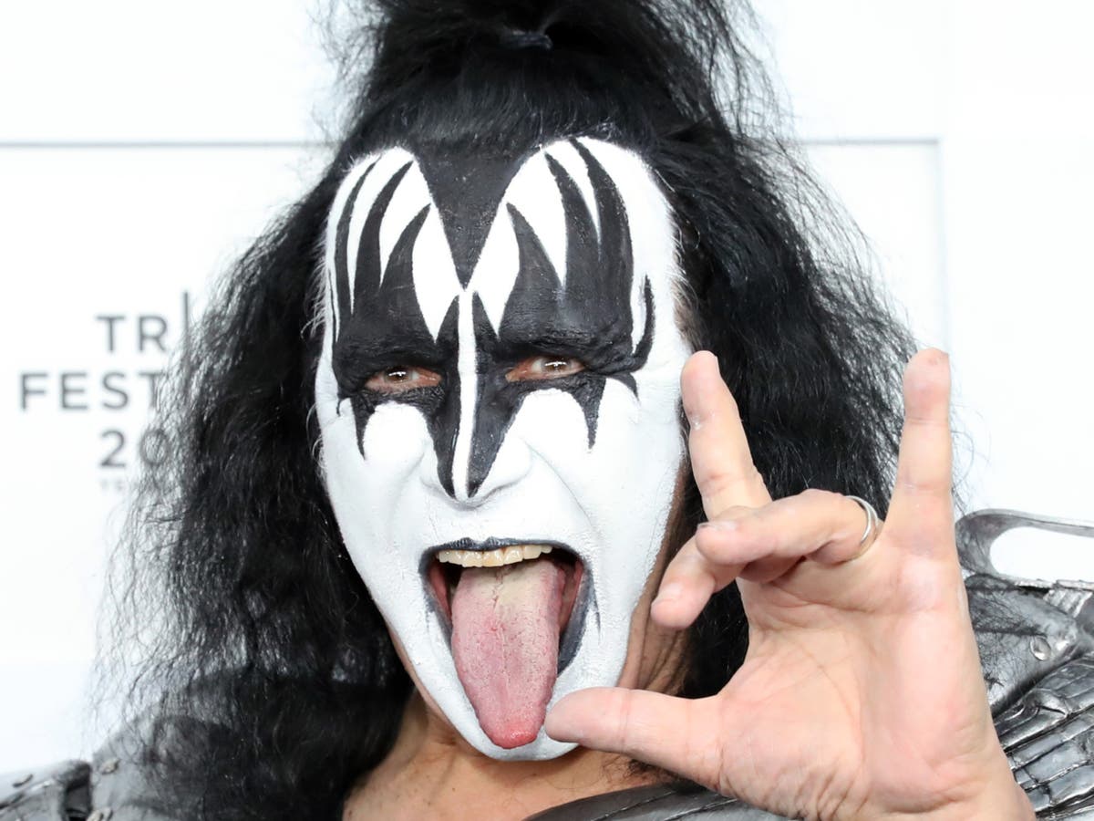 Gene Simmons performs from a chair after becoming ‘obviously sick’ during Kiss concert