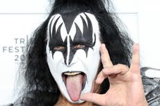 Gene Simmons performs from a chair after becoming ‘obviously sick’ during Kiss concert
