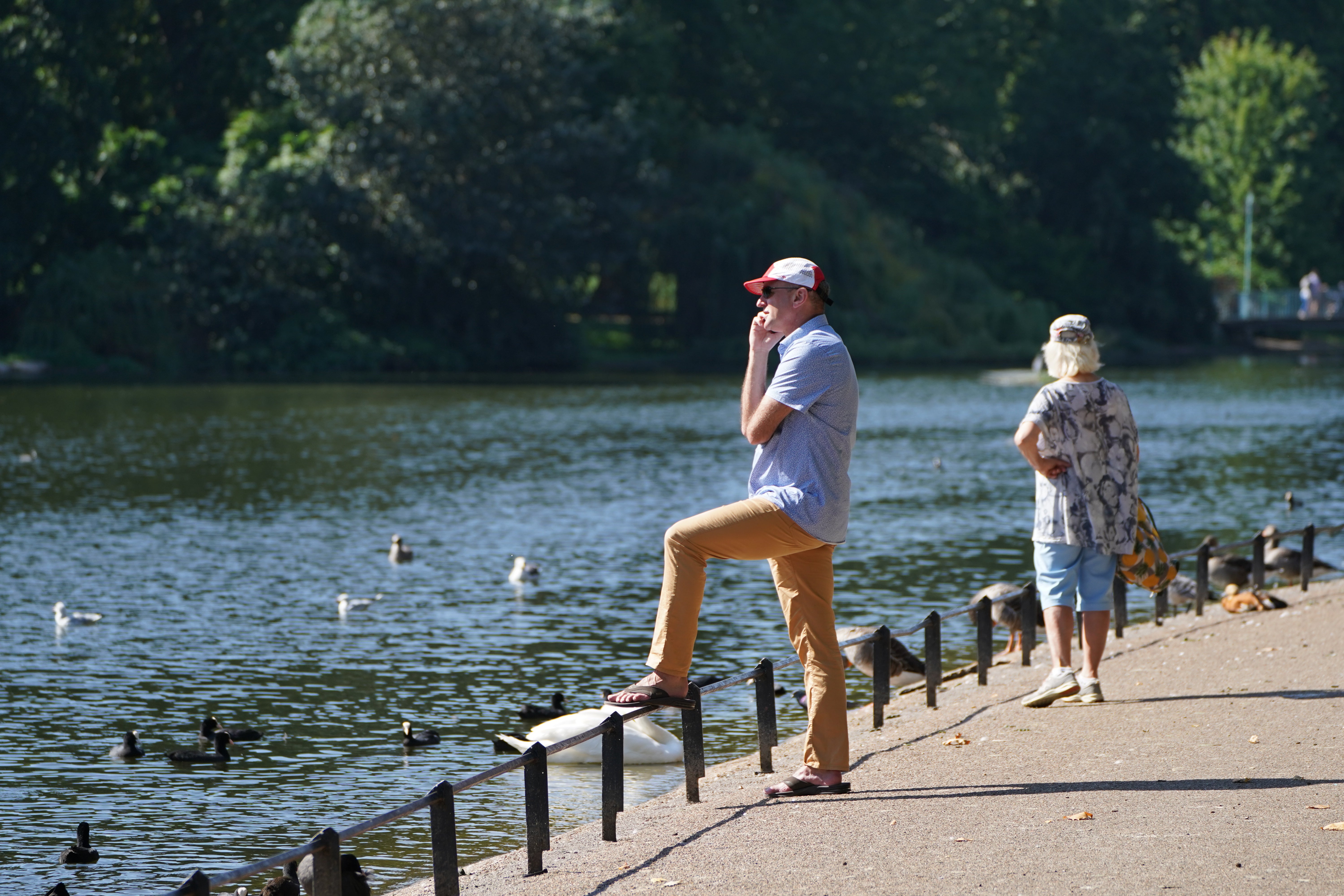 People enjoy the hot weather in St James’s Park in central London (Stefan Rousseau/PA)